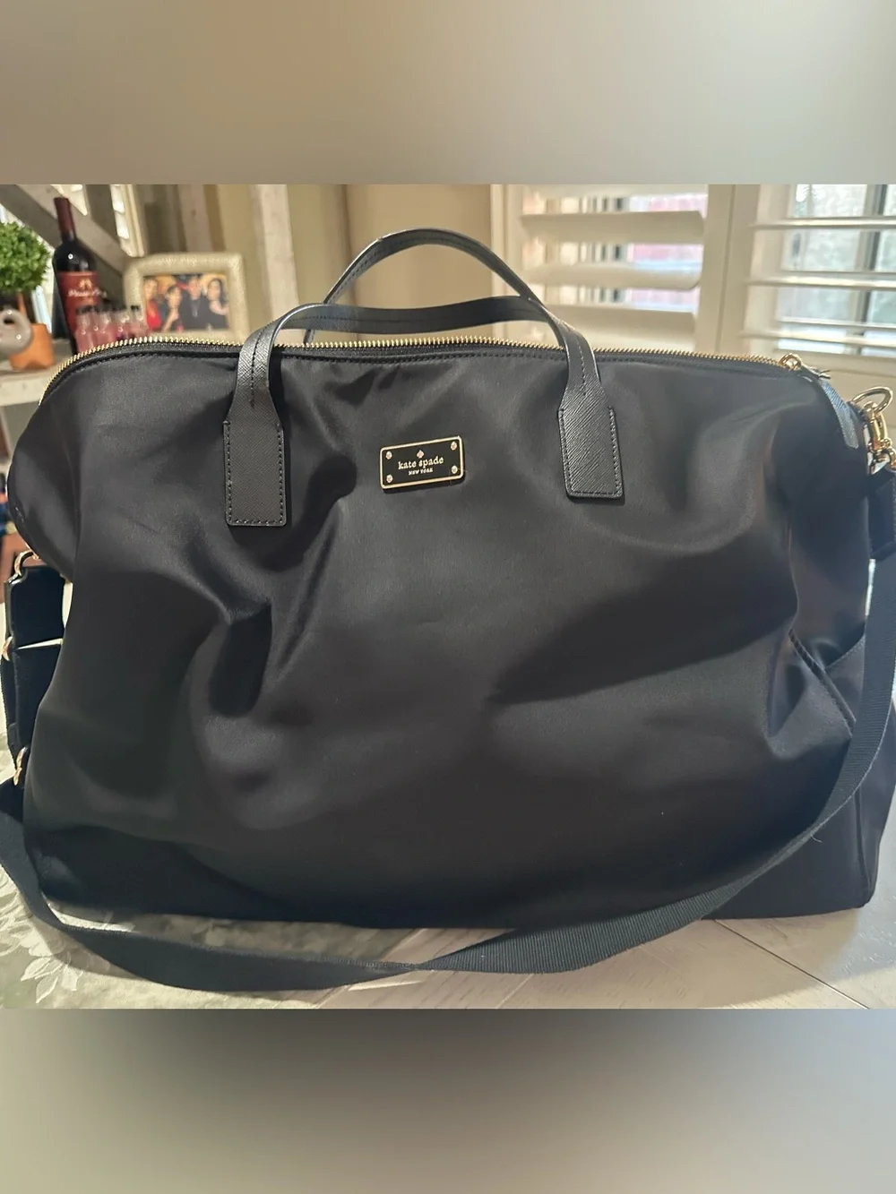 kate spade black nylon duffel with gold hardware